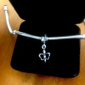 Retired Pandora “Fleur De Lis” dangle charm.